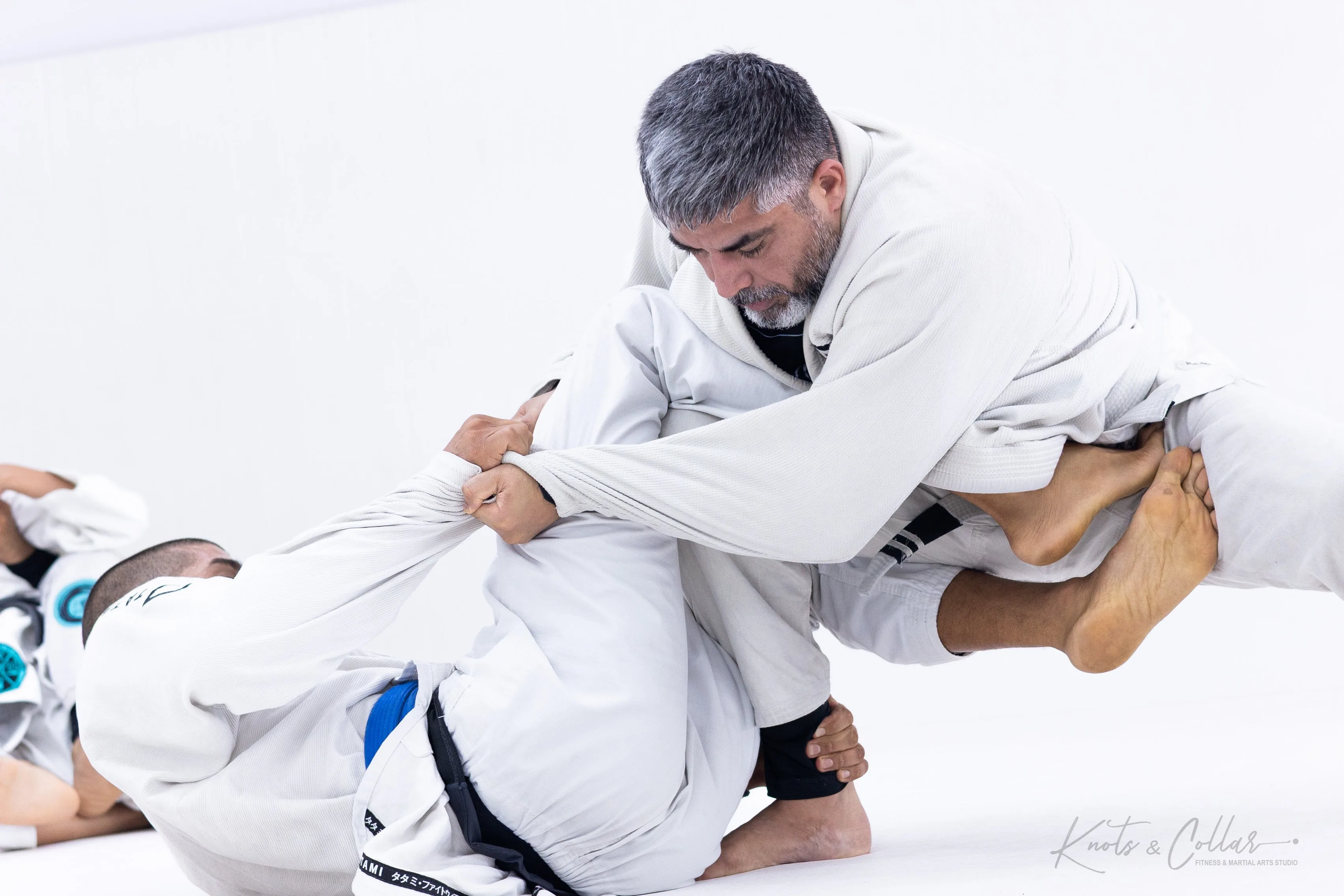 Adult BJJ gi guard passing at Knots and Collar Defence Colony New Delhi