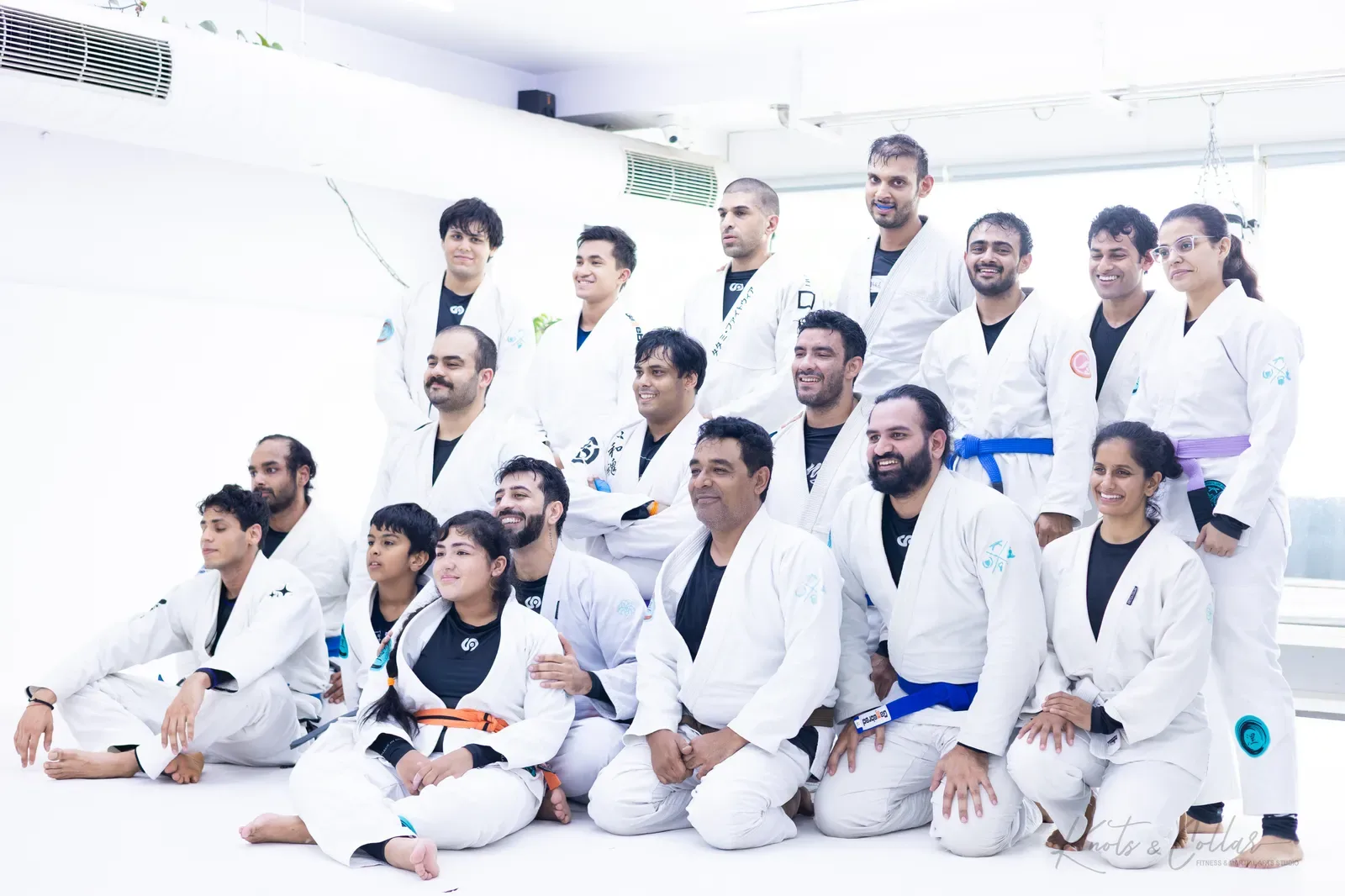 The same BJJ class group at Knots & Collar in Delhi a moment later, laughing between frames