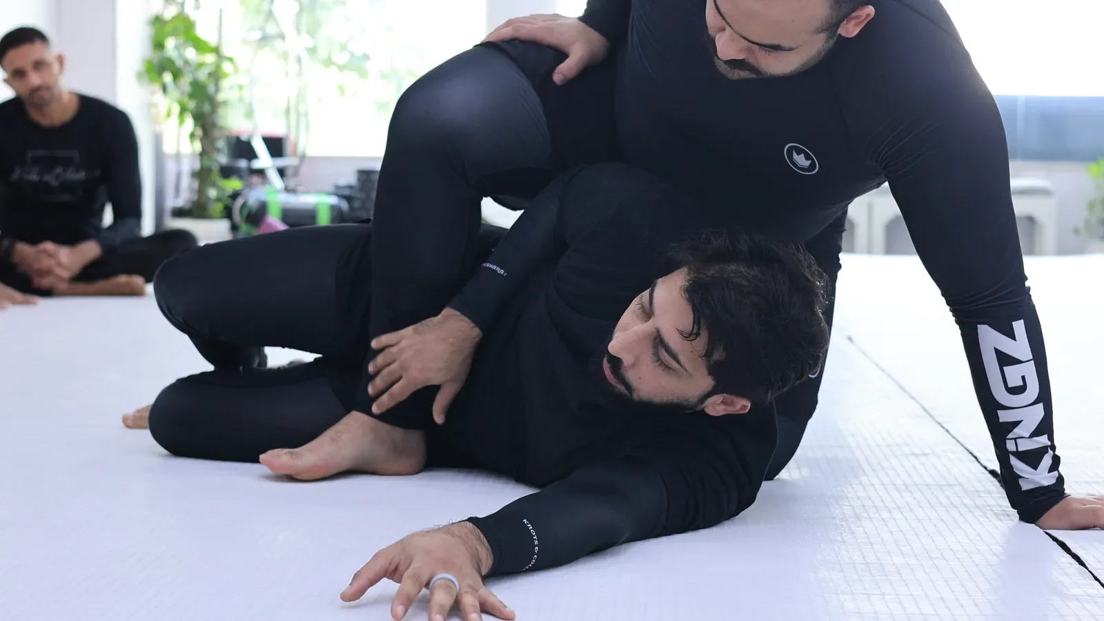 Escaping technical mount with the elbow against the heel in a No-Gi BJJ class at Knots & Collar, India