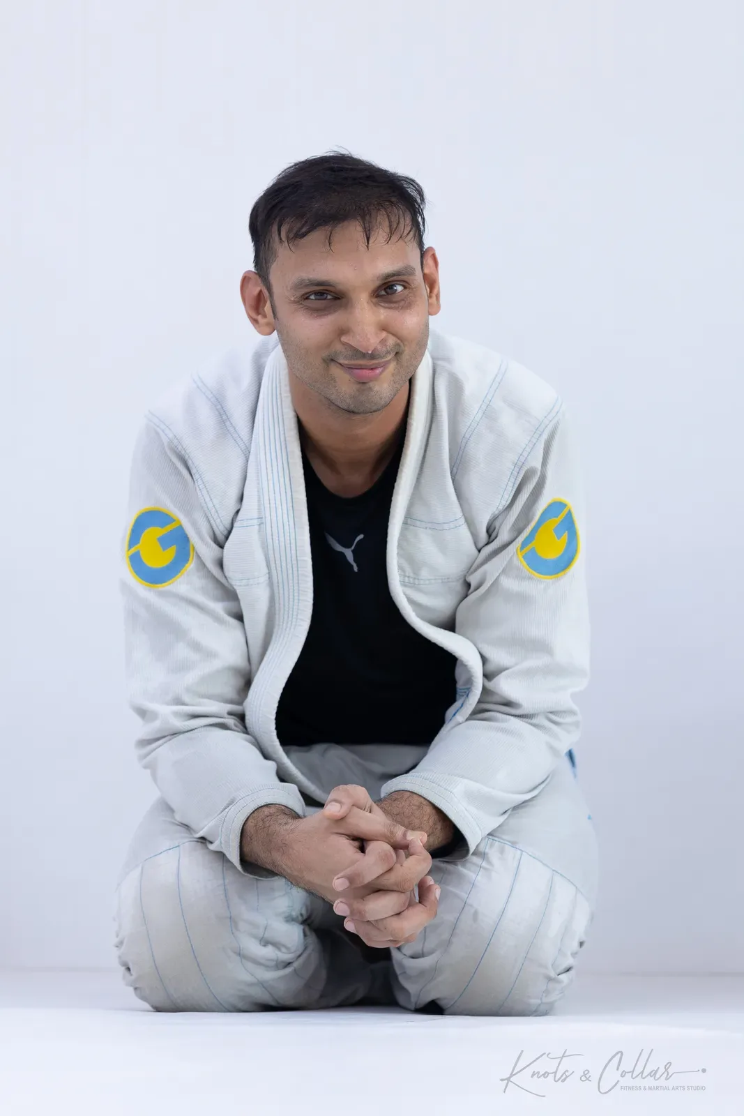 A student wearing a rashguard under the gi jacket at Knots & Collar, Defence Colony, New Delhi