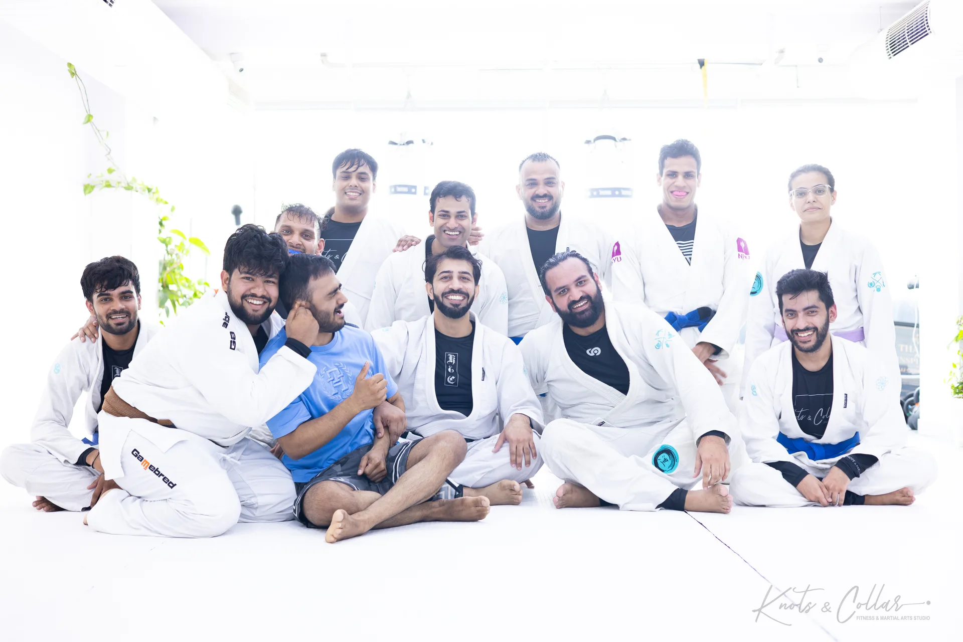 The Knots & Collar team in white gis after a Brazilian Jiu-Jitsu class in Defence Colony, New Delhi