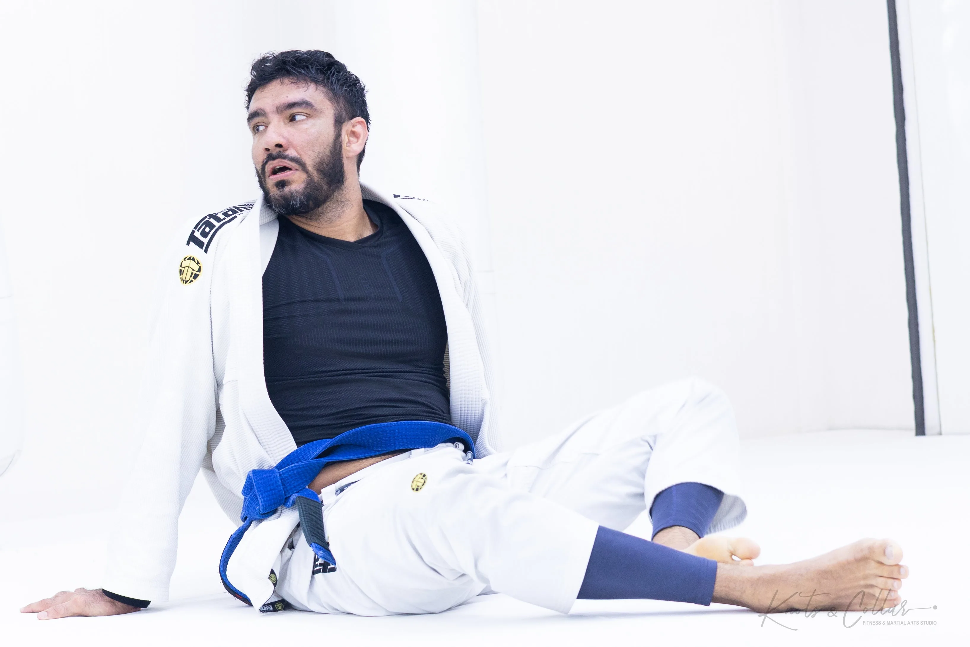 Blue belt BJJ practitioner during a mat training session