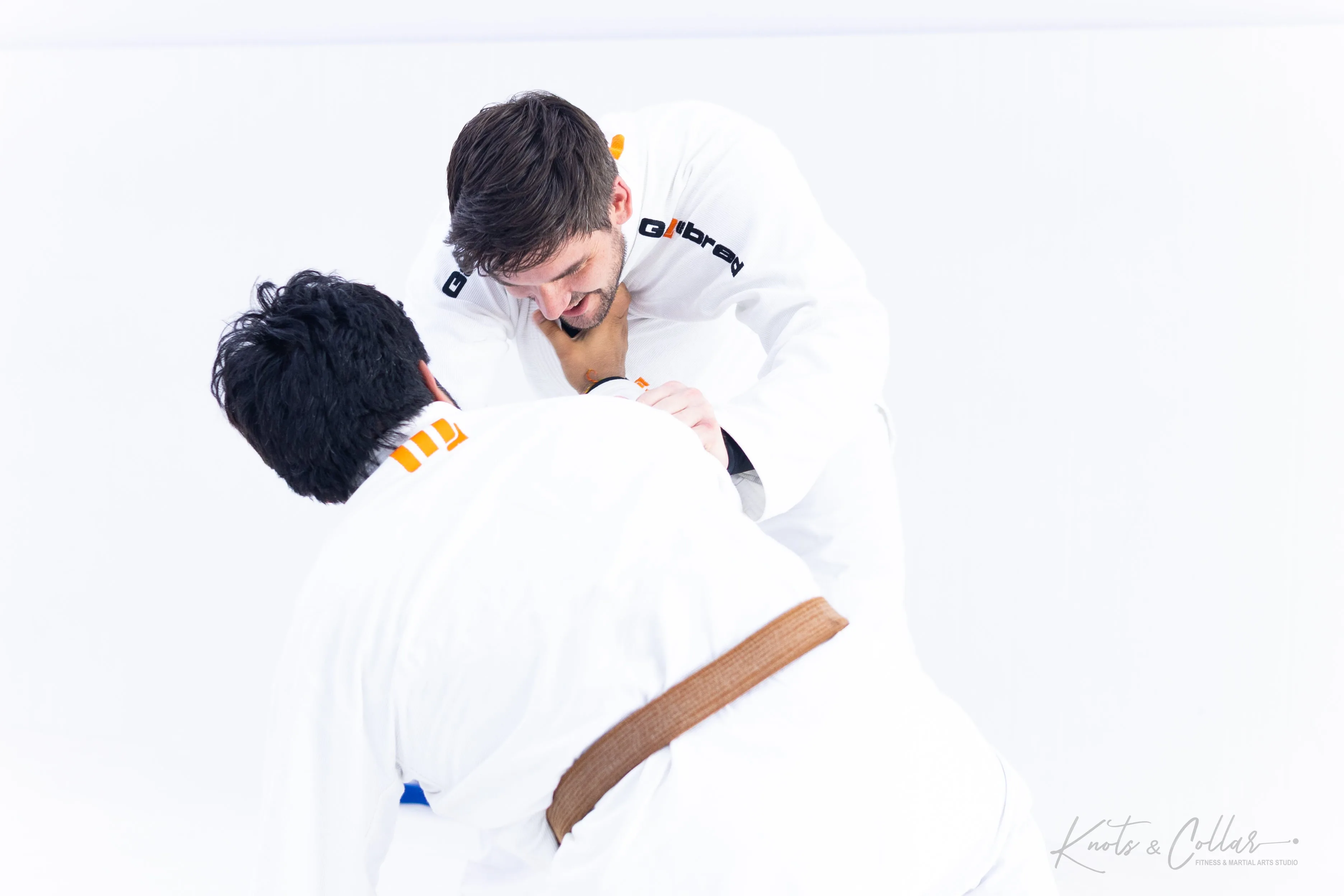Brown belt BJJ practitioner sparring and drilling technique