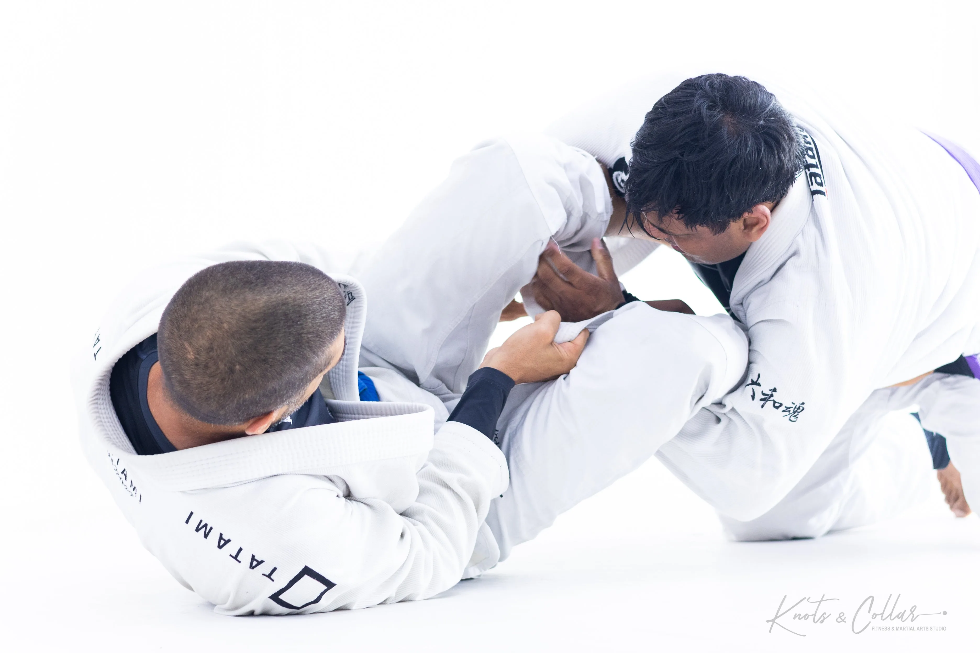 BJJ ground control position during gi sparring at Knots and Collar New Delhi