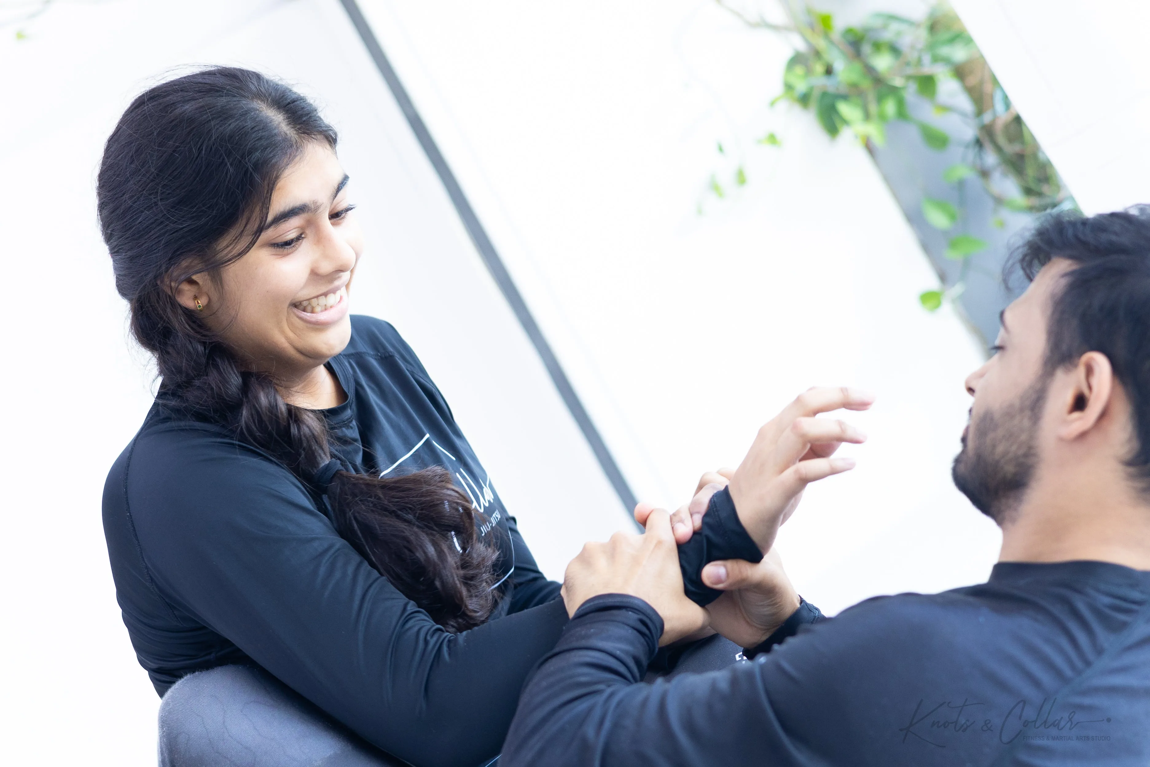 Woman learning BJJ technique at Knots and Collar Defence Colony New Delhi