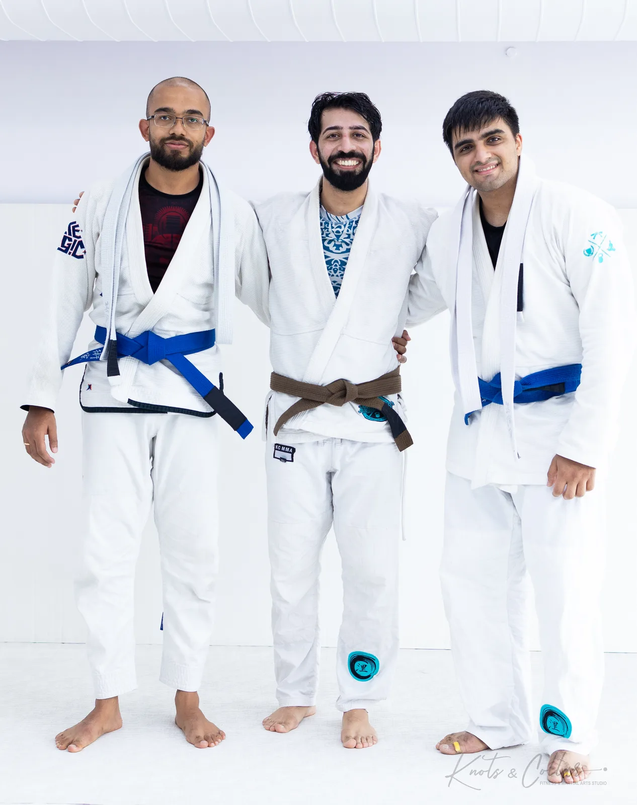 Devanshu Bajpai, on the left, with a training partner and his coach in white gis at Knots & Collar in Defence Colony, New Delhi