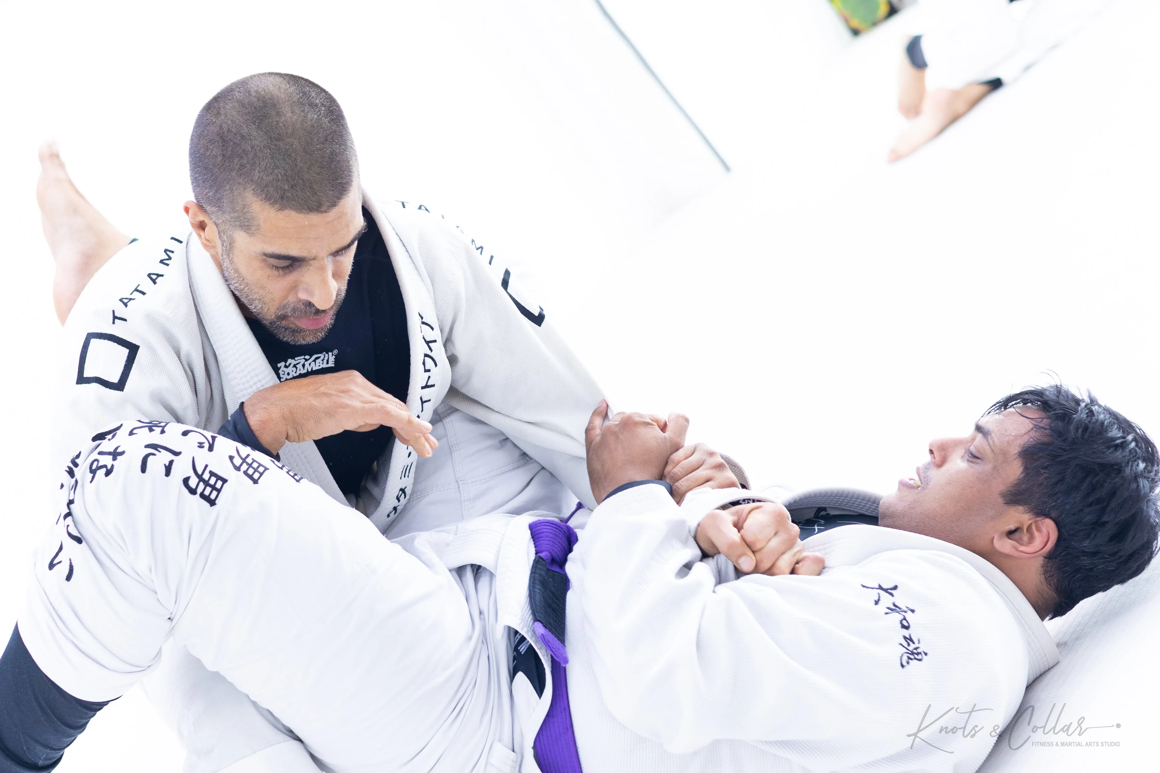 BJJ blue belt student at Knots and Collar working guard pass at Knots and Collar Delhi