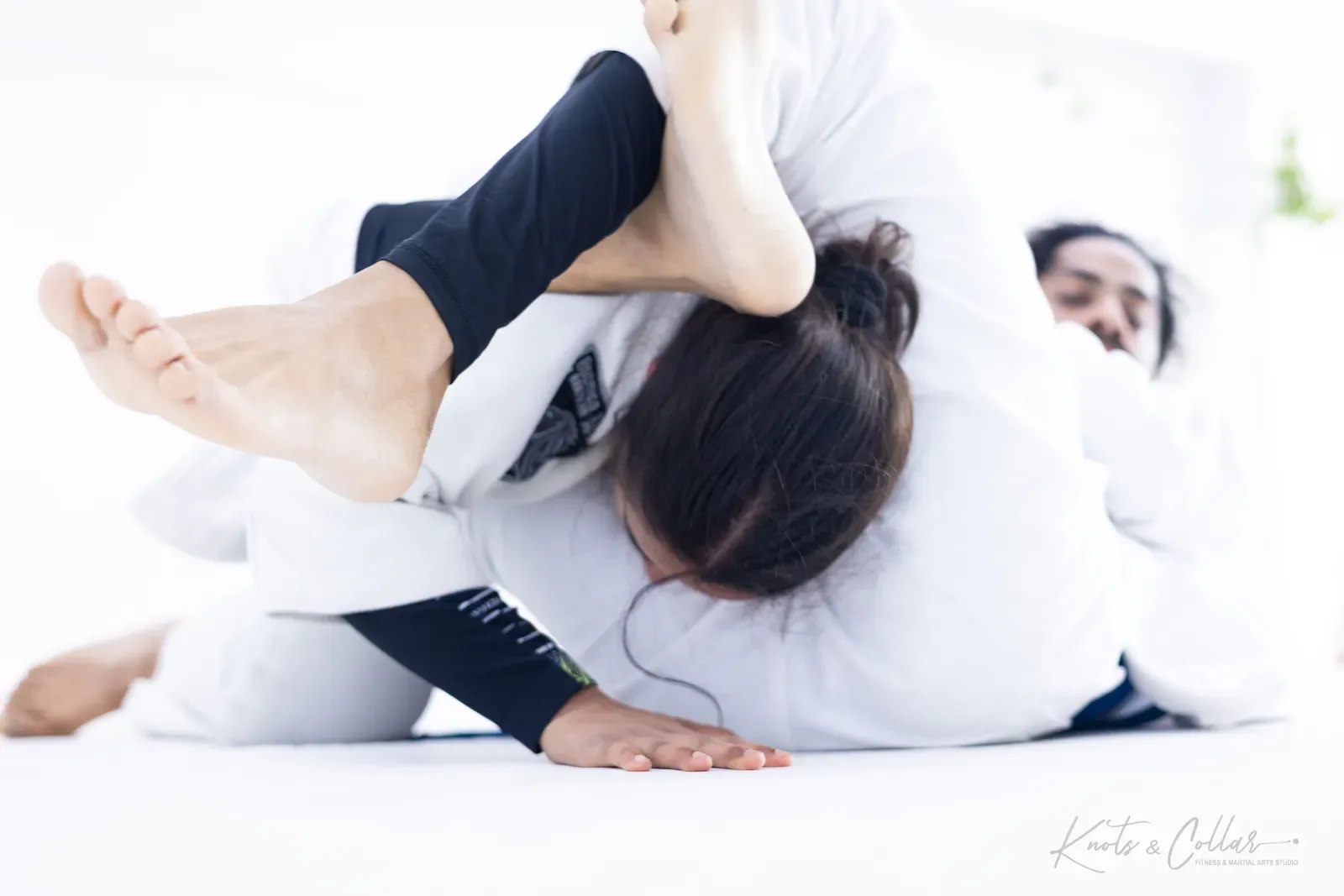 Working a submission in the gi at Knots & Collar, Defence Colony, New Delhi, India