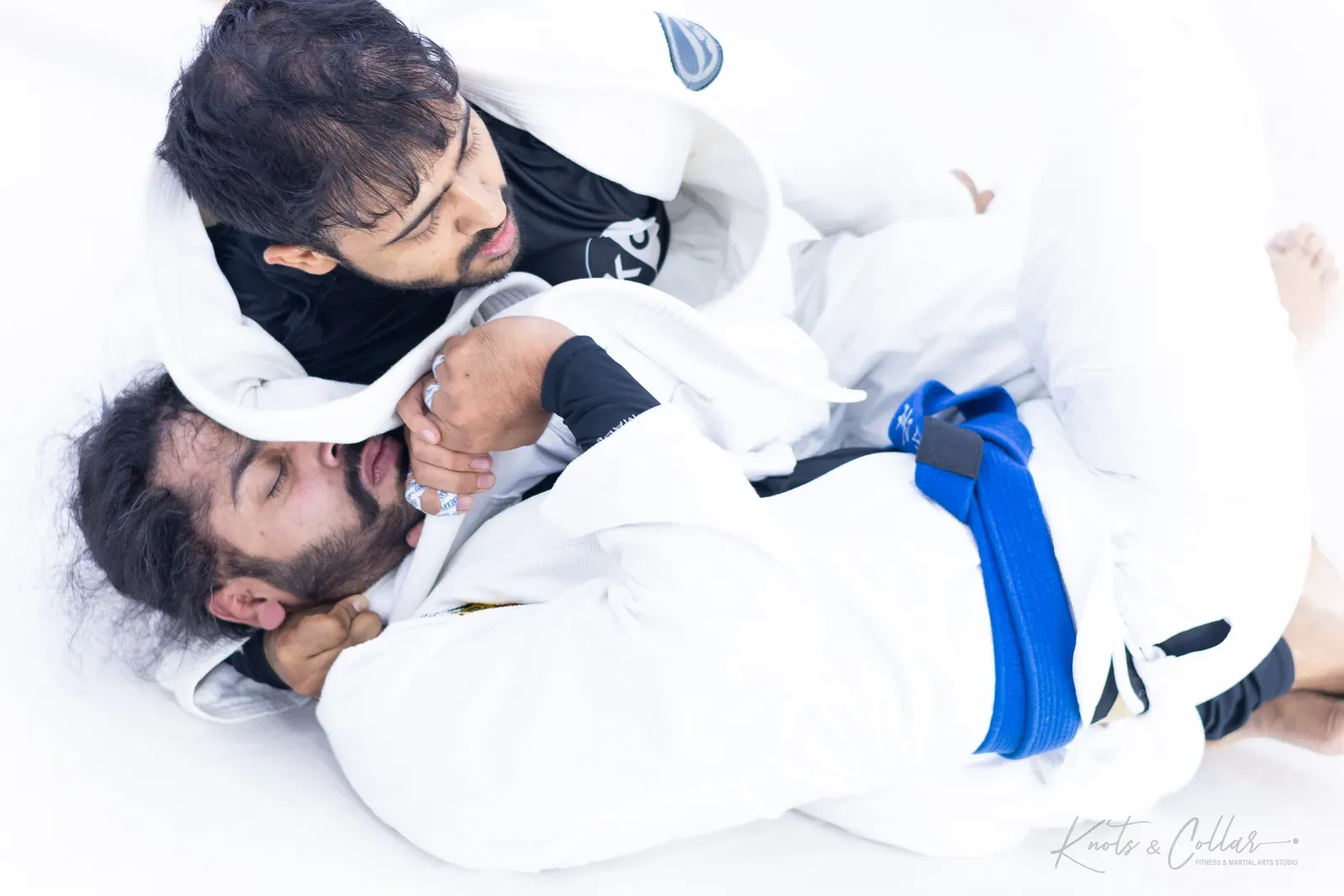 Working a submission in the gi at Knots & Collar, Defence Colony, New Delhi, India
