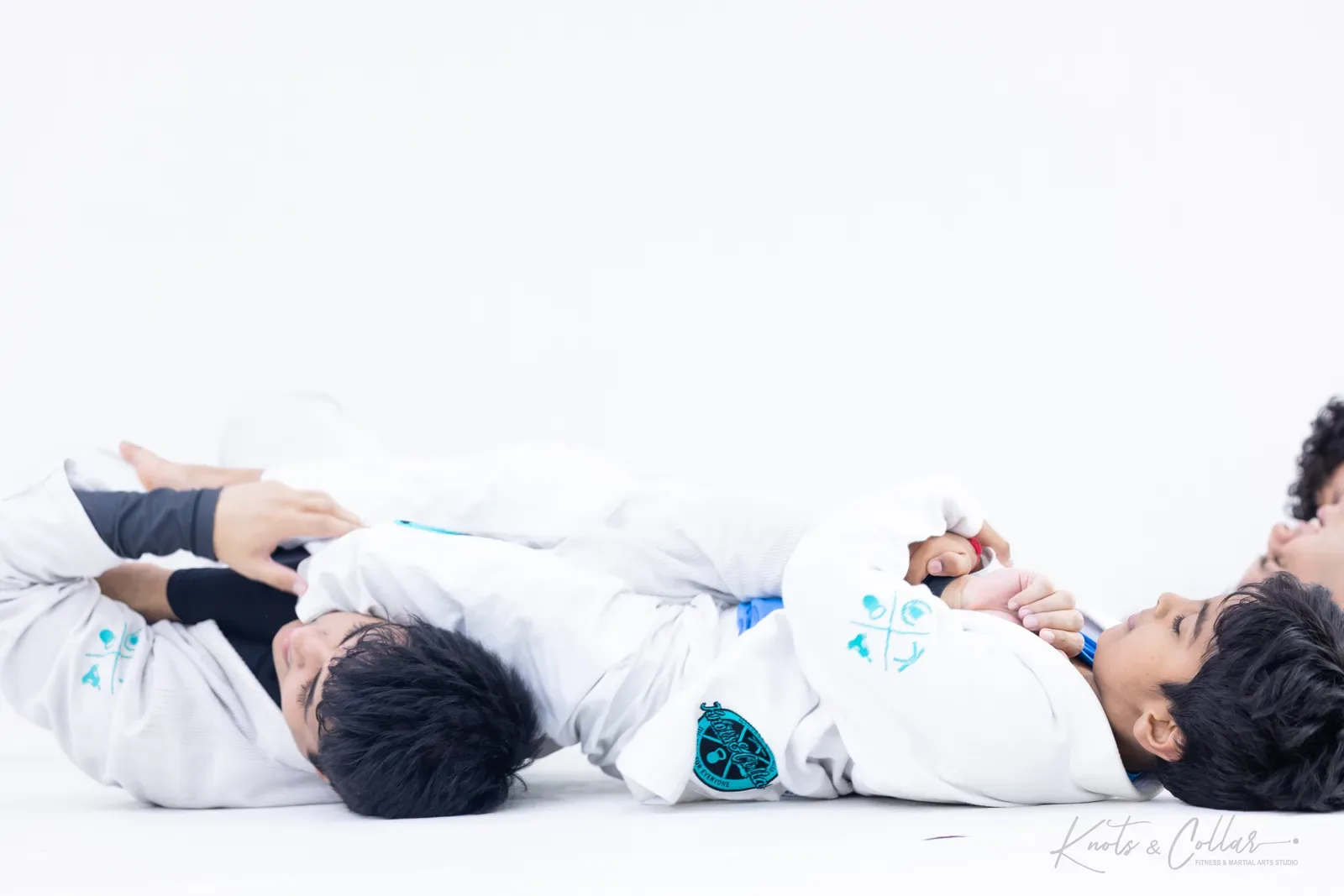 Taking the back with hooks in during live BJJ rolling at Knots & Collar, New Delhi