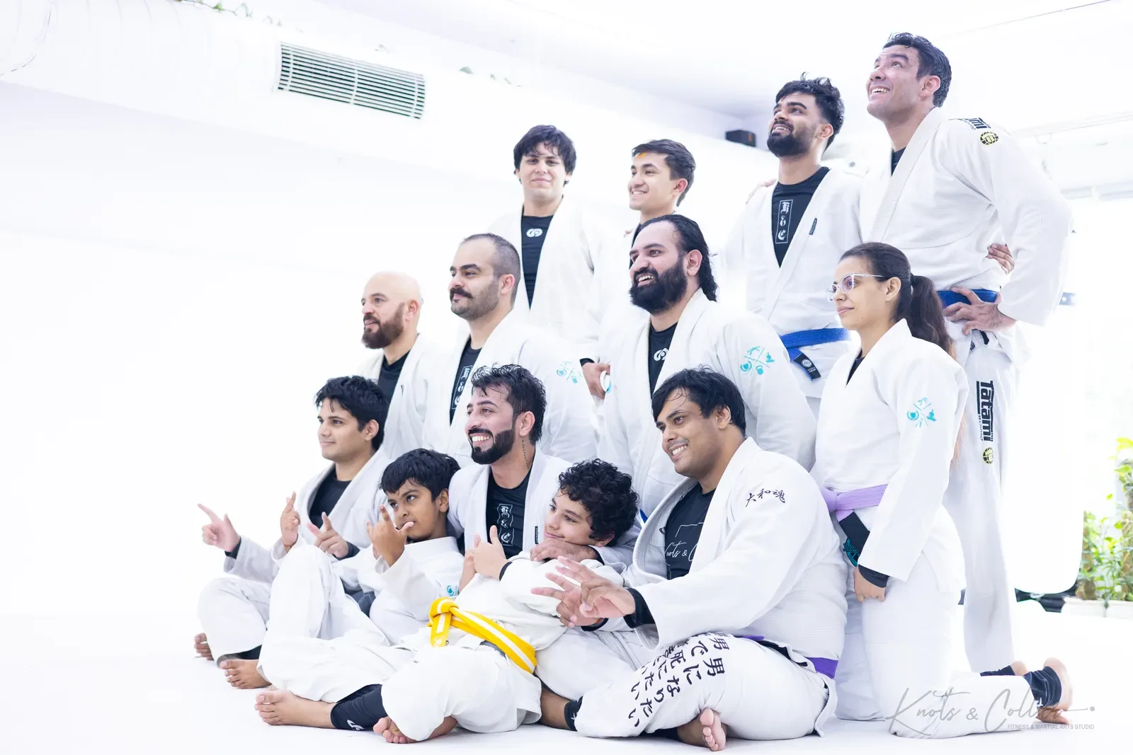 Adults and kids of Knots & Collar Brazilian Jiu-Jitsu on the mat in New Delhi, India