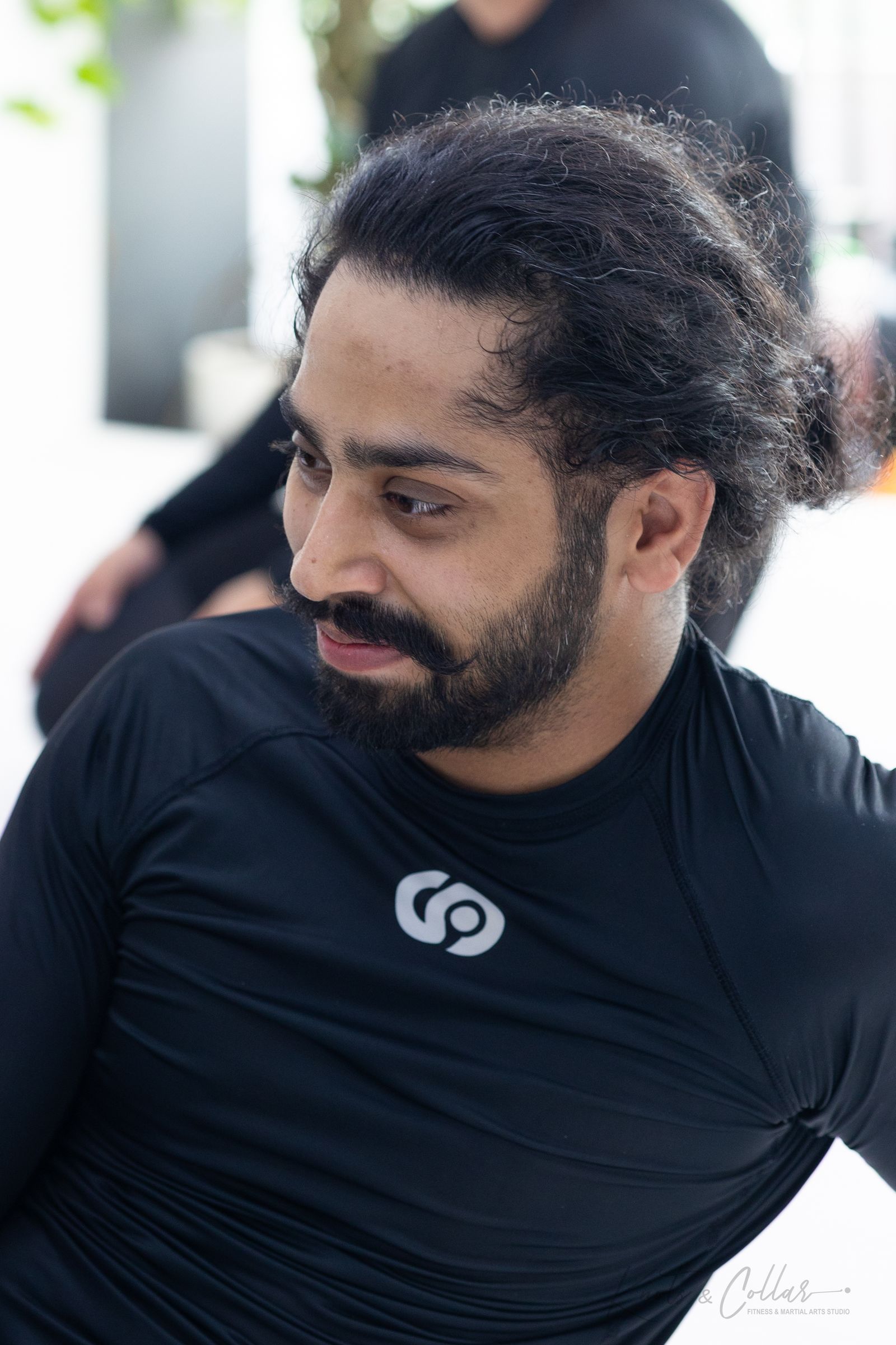 Knots & Collar M2HK rashguard in black, worn on the mat