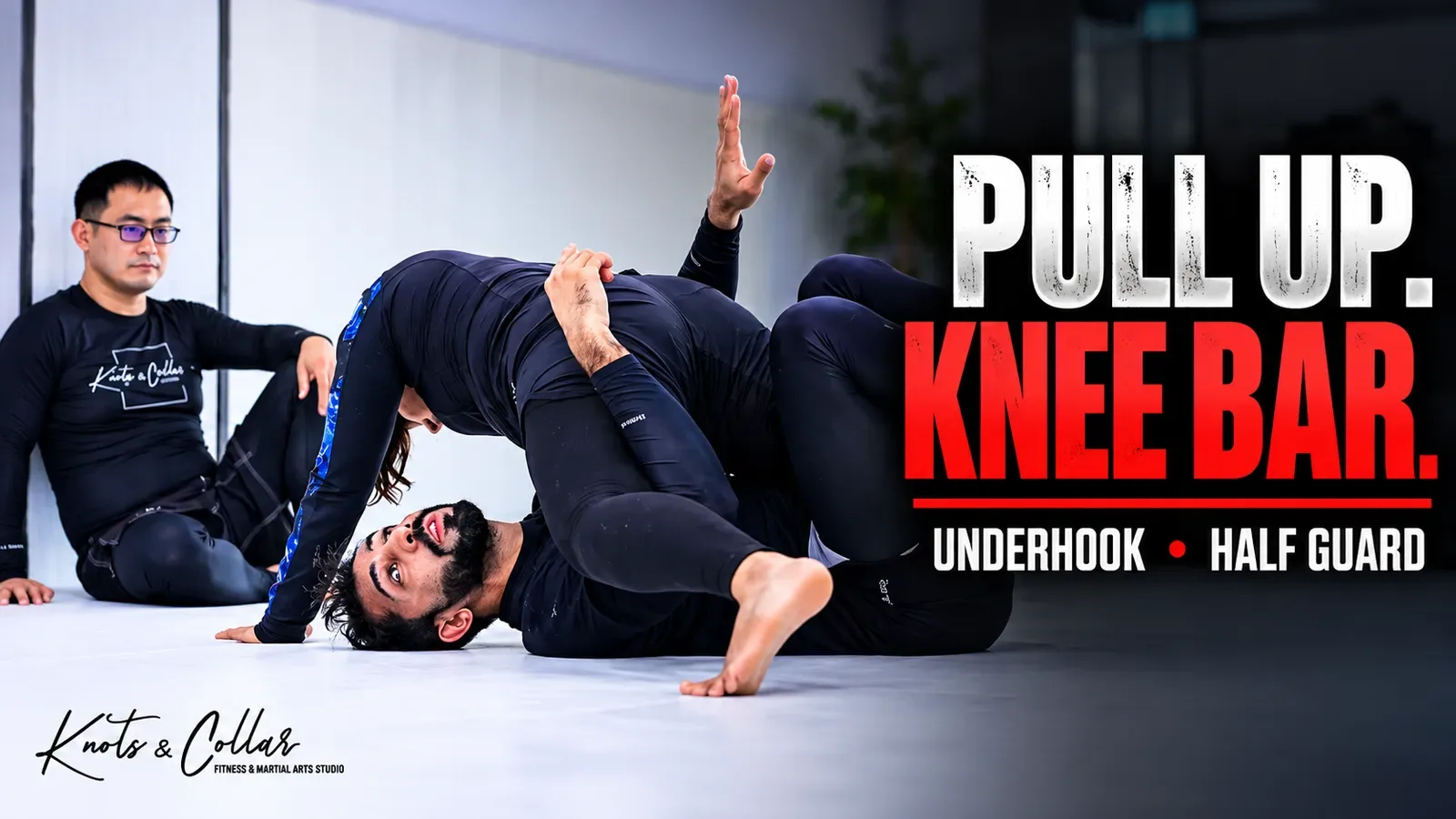Knee bar from half guard in a No-Gi BJJ class at Knots & Collar, India: underhook, pull up and capture the knee between the thighs