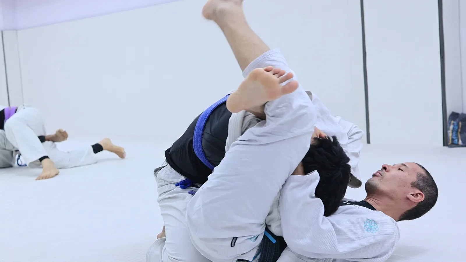 Professor Bek sweeping from his back during the Brazilian Jiu-Jitsu seminar at Knots & Collar, New Delhi, India