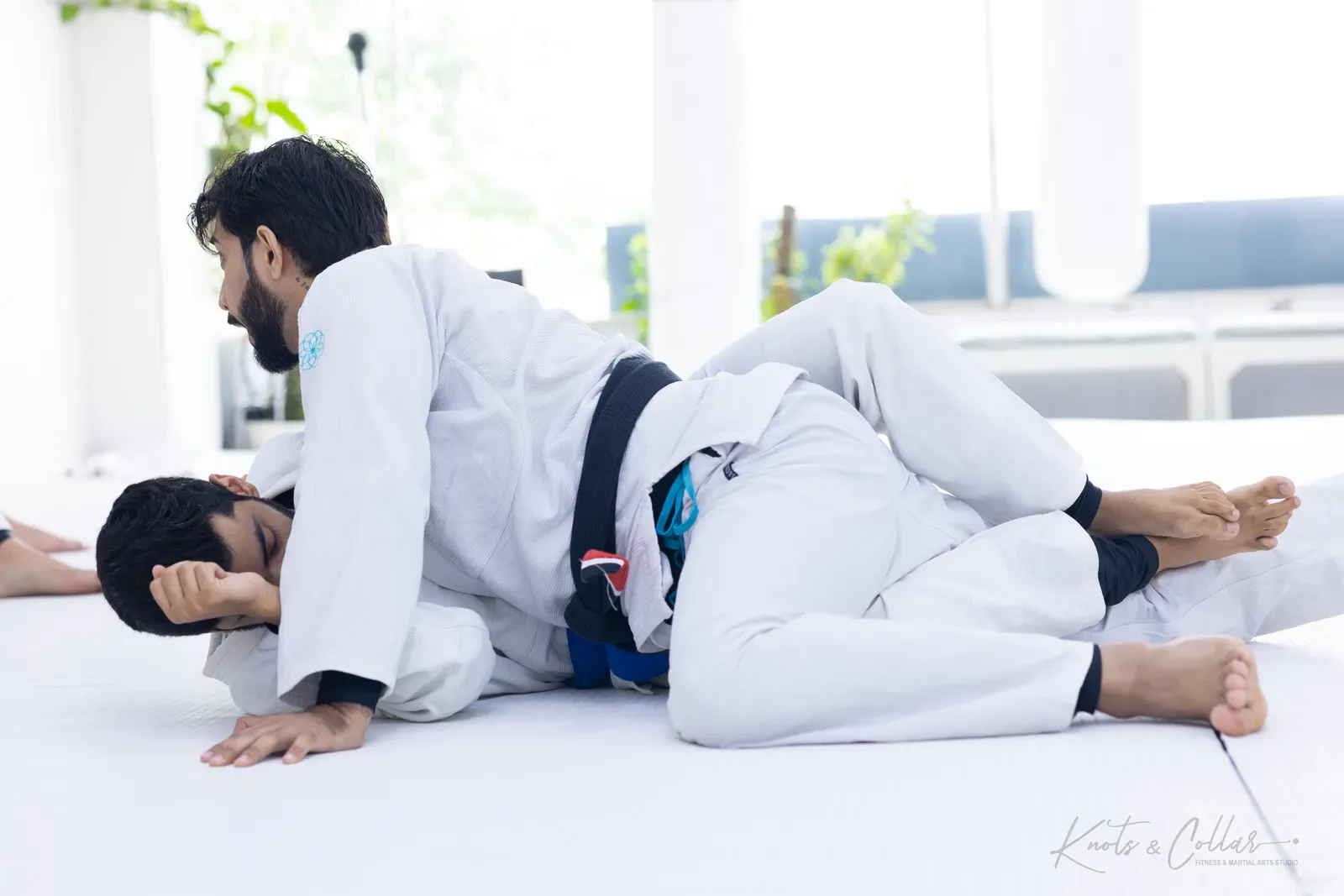 Professor Binish Sukhija — De La Riva black belt — on the mat at Knots & Collar, Defence Colony, New Delhi, India