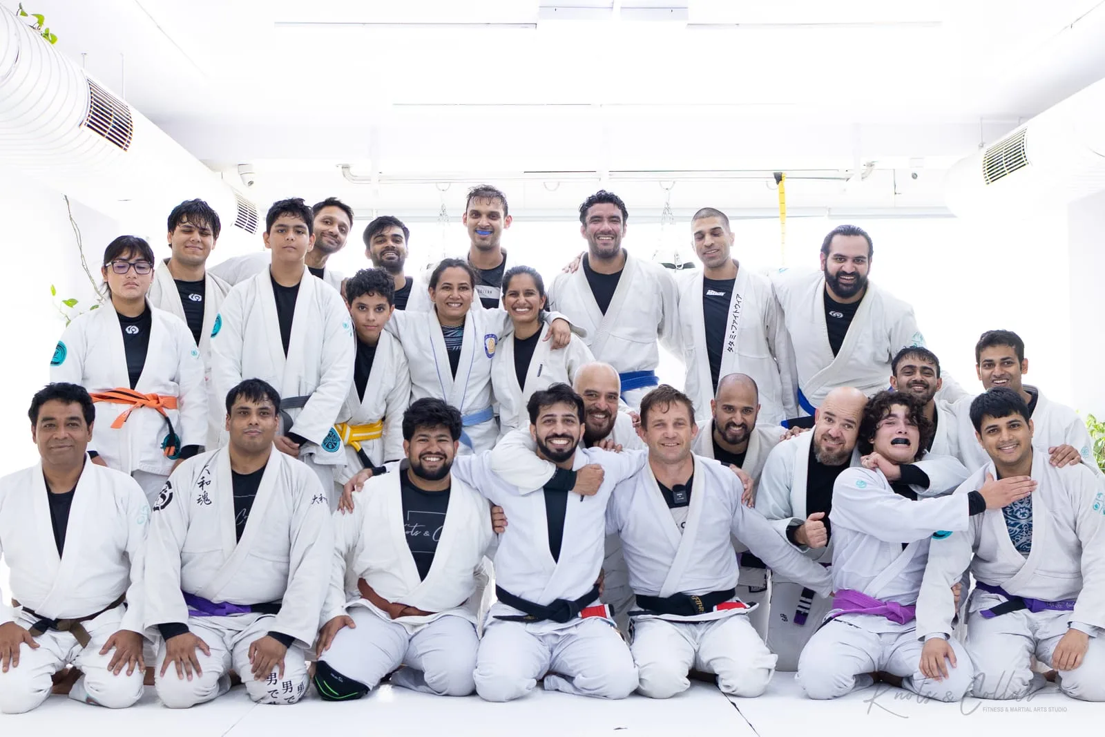 Professor Jad Strutzel with the full Knots & Collar gi class — adults, teenagers and children in white gis — after his surprise Judo for jiu-jitsu class in Defence Colony, New Delhi